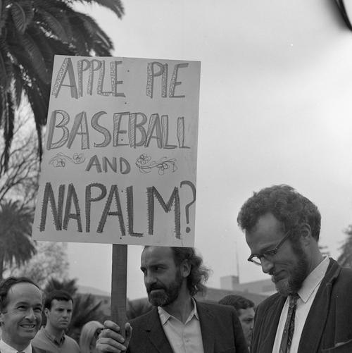Men standing with protest sign