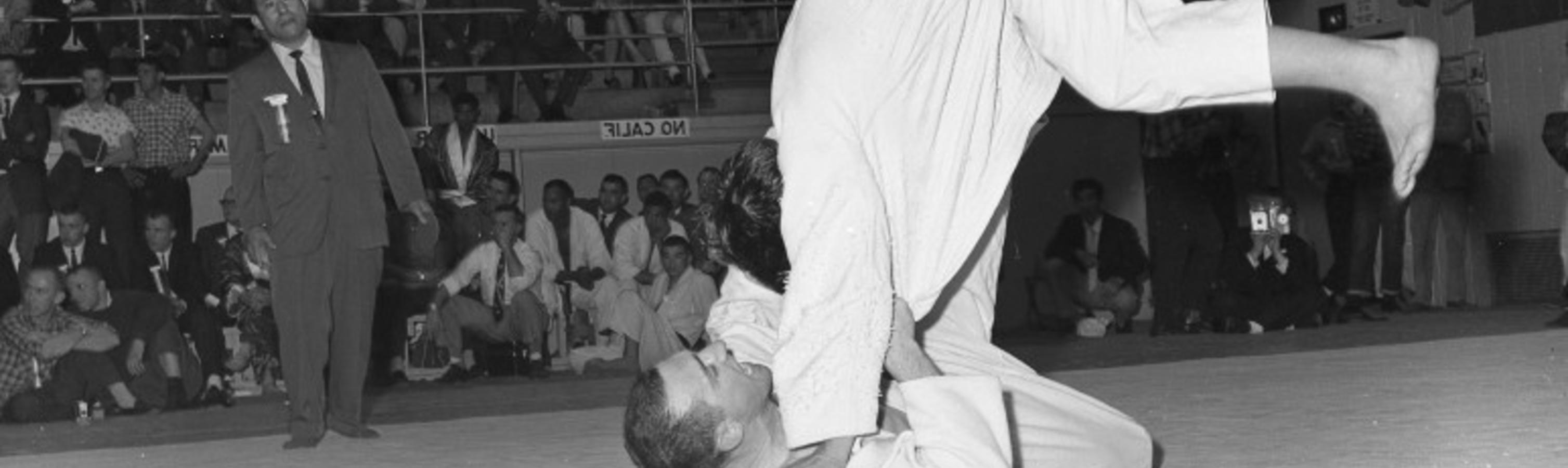 Two men compete in a judo match.