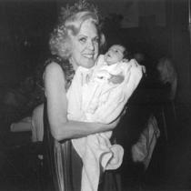 Dorene Tinney holding a baby.