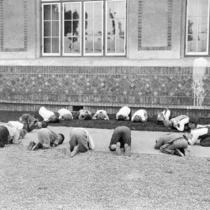 Children kneeling on the ground at San Jose State.