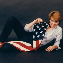 Claire Mix posing with the American Flag