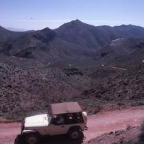 Driving a Jeep along the winding road of Titus Canyon