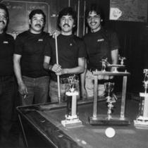 Four mustached billiards players