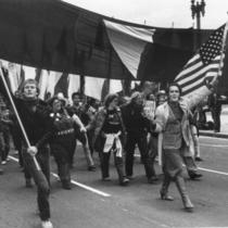 Marchers led by man with America flag