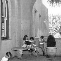 Children reading inside San Jose State's portico.